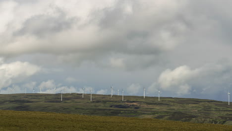 Time-Lapse-of-wind-turbines-with-dramatic-clouds-in-remote-landscape-of-Ireland