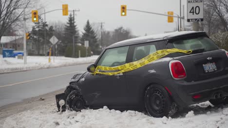 Crashed-compact-car-on-the-side-of-Knoxdale-Road-in-Nepean,-ON