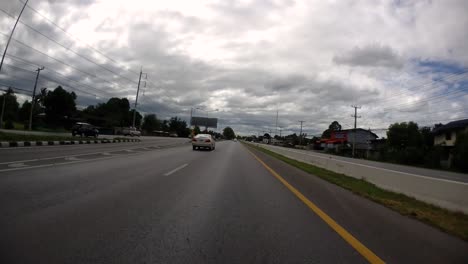 This-is-a-time-lapse-with-an-action-camera-mounted-in-front-of-the-truck,-driving-from-Pranburi-to-Hua-Hin-and-Hua-Hin-to-Bangkok-on-Phet-Kasem-Road