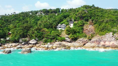 Luxury-hotels-and-resorts-on-the-rocky-coast-of-thailand-island-with-palm-forest
