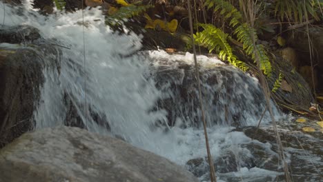 Waterfall-splashes-along-the-rocks-as-it-flows-down-the-river---concept:-tranquil,-peaceful,-soothing,-harmony,-nature,-balance