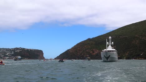 Luxury-yacht-MV-Katharine-in-Knysna-Lagoon,-heading-for-harbour