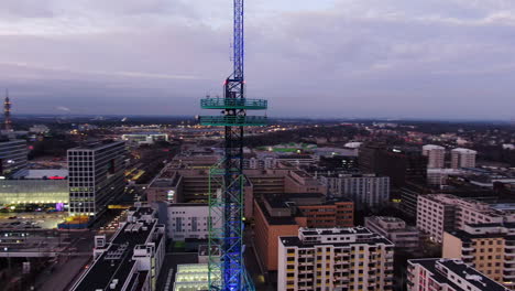 Aerial-drone-view-of-Elisa-communication-tower-in-Pasila,-Helsinki-Finland