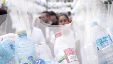 A-maze-made-with-plastic-bags-filled-with-empty-plastic-bottles-during-the-La-Merce-Festival-in-France---close-up