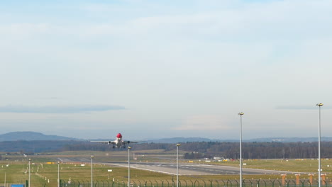 Close-up-static-shot-of-an-Edelweiss-A330-airbus-take-off-from-Zurich-airport,-Switzerland