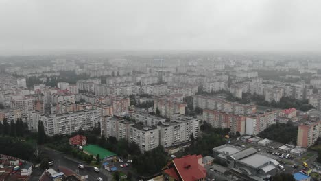 Aerial-View-of-Vast-Apartment-Blocks-in-Europe-on-a-Foggy-Day