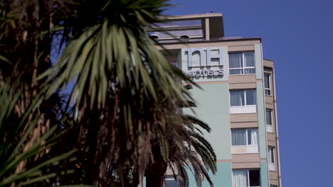 Hotel-in-La-Spezia,-Italy-with-a-tree-in-the-foreground