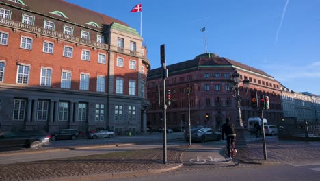 The-downtown-traffic-of-cyclists-riding-bicycles-and-cars-in-Copenhagen