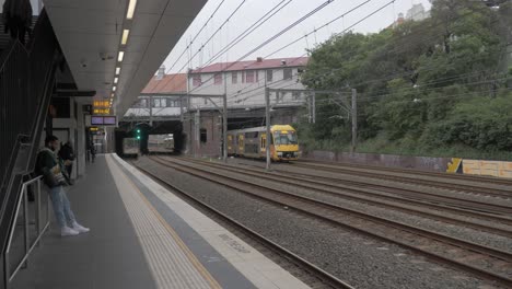 Double-Decker-Train-Leaving-Redfern-Train-Station---Coronavirus-Pandemic---Sydney,-NSW,-Australia