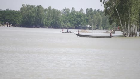 Flood-affected-people-of-Bangladesh-are-moving-in-a-boat-after-the-flood-has-destroyed-their-houses