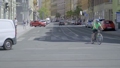 Biker-on-City-Streets-of-Beautiful-Prague,-Czech-Republic