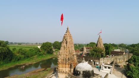 ancient-Indian-temple,-Varanasi-India-ancient-city-architecture-panoramic-view-at-sunset-as-seen-from-a-boat-on-river-Ganges-1