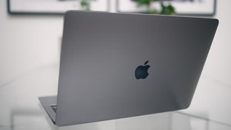 Close-view-from-back-of-space-grey-MacBook-being-opened-and-closed