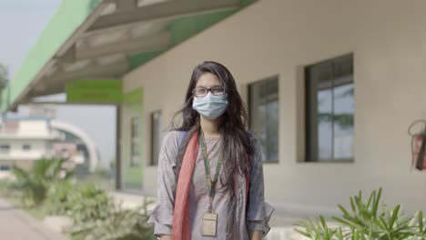 Girl-standing-with-mask-on-the-face-during-covid-pandemic