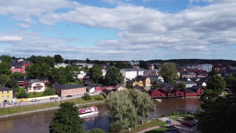 Aerial---Beautiful-Porvoo,-Finland,-and-Porvoonjoki-River,-wide-shot-rising