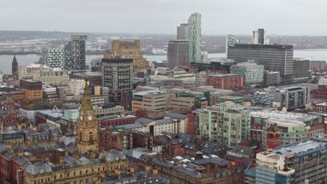 Aerial-view-across-highrise-Liverpool-city-skyline-empty-streets-during-corona-virus-pandemic-pan-left