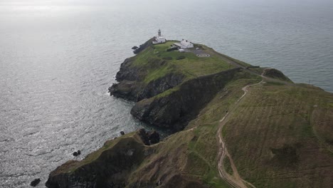 Baily-Lighthouse,-Dublin-Bay-And-Howth-Cliff-Path-In-Ireland---aerial-drone-shot