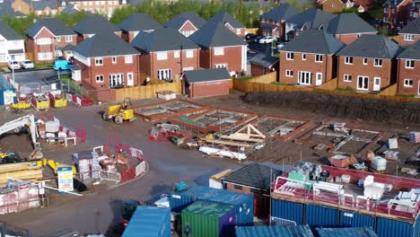Construction-site-aerial-view-above-new-urban-real-estate-housing-development-regeneration-slow-low-dolly-right