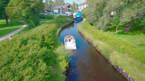 A-small-motorboat-sails-into-the-harbor-on-lake-starnberg