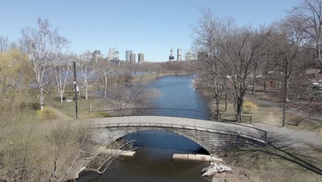 People-walking-near-pedestrian-bridge-at-Charles-Rover-Esplanade,-Boston