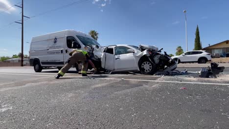 Firefighter-sweeps-road-at-crash-scene