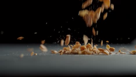 Candied-almonds-fall-on-a-table-in-slow-motion
