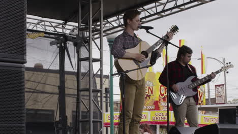 Singer-and-bassist,-concert-at-Dogwood-Festival,-Siloam-Springs,-AR,-wide-shot