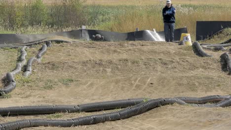 Electric-remote-control-buggies-seen-hitting-jumps-on-dirt