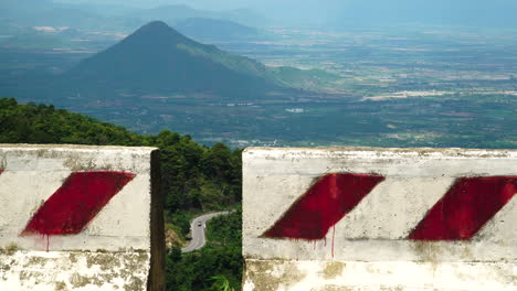 shot-of-winding-road-against-beautiful-mountain-backdrop-in-Vietnam