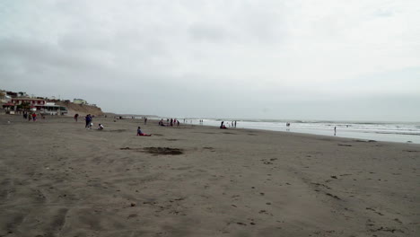 Pacasmayo,-La-Libertad,-Peru:--Beach-with-town-Pacasmayo,-Peru-at-the-Pacific-Ocean-Static-aerial-drone-view-of-Beach-at-a-sunny-day