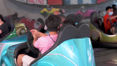 Visitors-of-all-ages-enjoy-the-Bumper-Blaster-cars-ride-at-the-amusement-and-animal-theme-park-Ocean-Park-in-Hong-Kong