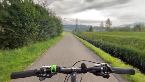 Handsfree-cycling-through-Switzerland-countryside