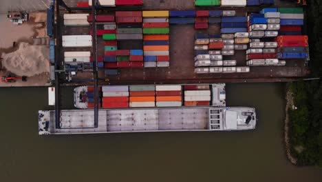 Aerial-Of-Cargo-Container-Transfer-Facility-In-Ridderkerk-With-Eiger-Ship-Docked