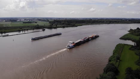 Aerial-High-Angle-View-Of-Alsace-Cargo-Ship-Passing-Another-On-Oude-Maas