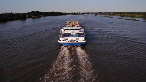 Aerial-From-Stern-Of-Zembla-Cargo-Ship-Travelling-Along-Oude-Maas