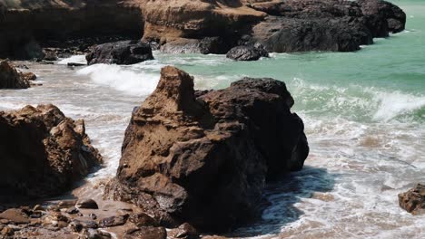 Ocean-Waves-Crashing-Around-Large-Rocks-On-Beach-At-Balochistan