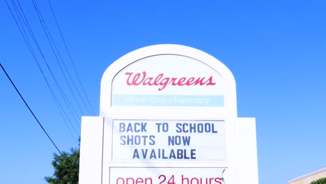 Back-to-School-Shots-COVID-19-Walgreens-Sign-Pan-Down-From-Sky