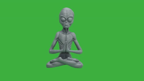 Close-up-of-praying-Alien-in-motion-in-front-of-green-screen