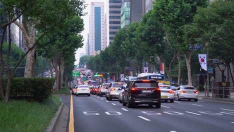 Gangnam-District,-Seoul,-South-Korea---Cars-Towards-Gangnam-Station-In-Traffic-At-Sunset