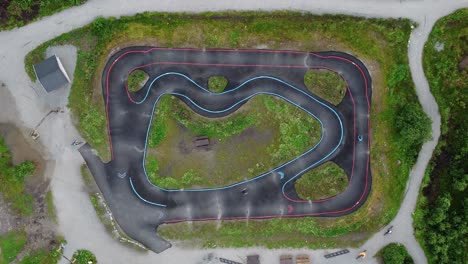 Persons-training-in-brand-new-asphalt-pump-track-at-Geilo-Norway---Static-birdseye-aerial