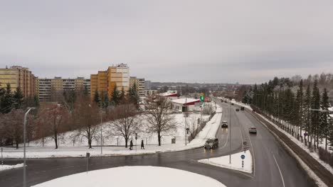 Drone-shot-over-ring-road-towards-old-soviet-architecture-9-floor-houses-in-Kivilinn