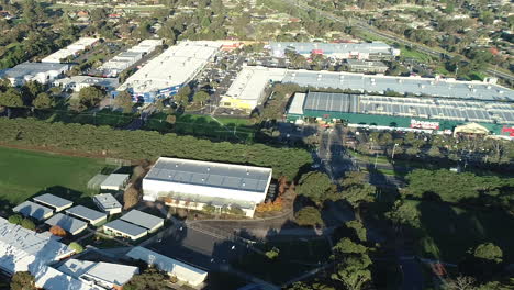 Smooth-aerial-accent-and-orbit-showing-local-Mornington-high-school-and-amenities-for-suburban-access