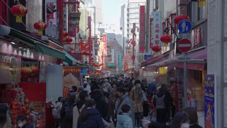 Busy-China-Town-Food-Street-City,-People-walking-in-background-slow-motion