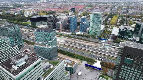 Bird's-aerial-view-of-Amsterdam-Zuid-Business-banking-district,-pan,-day