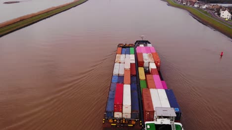 Antena-Sobre-Buque-De-Carga-Excelsior-Y-Barcaza-Que-Transporta-Contenedores-De-Carga-En-El-Río-Noord-Pasando-Crezeepolder