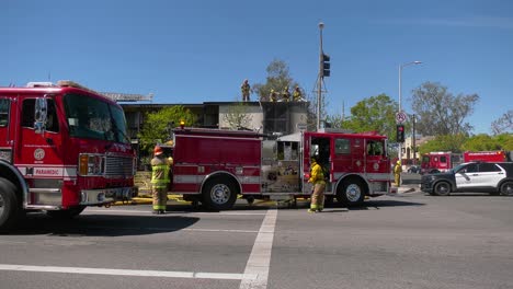 LA-fire-department-working-at-a-burned-house-in-California,-USA---static-view