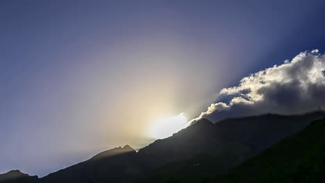 Sunset-through-clouds-in-timelapse-over-Tizi-n-test-Pass,-Atlas-mountains,-Morocco
