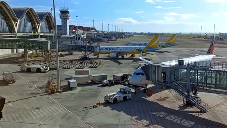 Wide-aspect-editorial-illustrative-view-of-a-newly-arrived-aircraft-coming-to-park-at-its-designated-spot-at-the-Mactan-Cebu-International-Airport,-Philippines