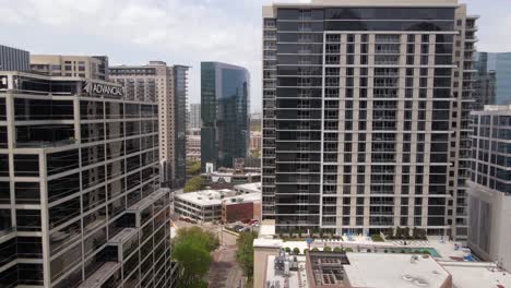 Aerial-view-of-office-buildings,-in-downtown-Dallas,-USA---tracking,-drone-shot