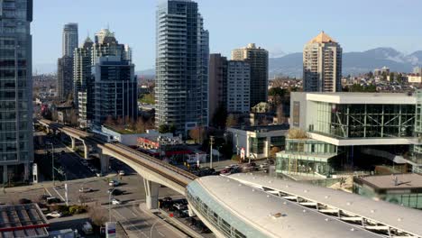High-rise-Buildings-In-Burnaby-City-With-Train-Leaving-At-Brentwood-Town-Centre-Station-In-Canada